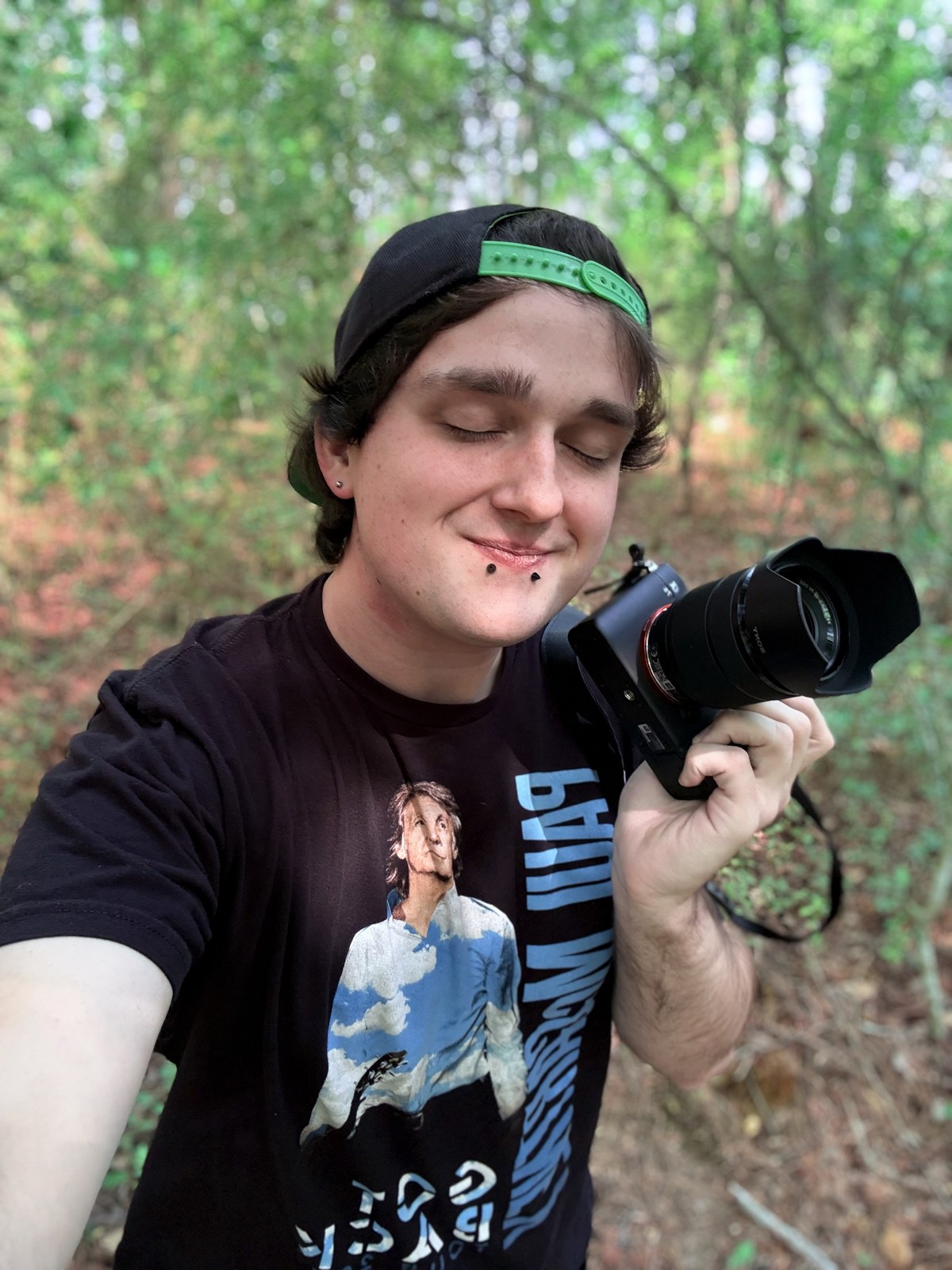 Andrew M. Németh — portrait with camera outdoors